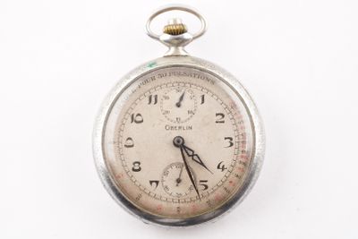 an old pocket watch with a chain hanging from it ' s side