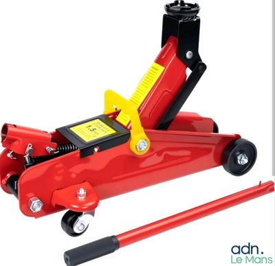 the red jack is sitting on top of a black dolly