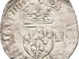 une pièce d'argent surmontée d'une couronne
