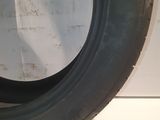 a close up of a tire tire on a white surface