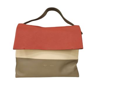 an image of a brown and red handbag on a white background