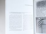 an open book with a drawing of a man on it