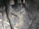 a close up of a car ' s floor with a dirty floor mat