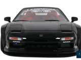 a black sports car with a red stripe on it