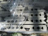 a plastic bag with holes in it sitting on the ground
