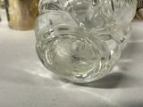 a glass vase that is sitting on a table