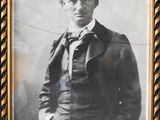 an old photo of a man in a suit and bow tie