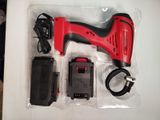 a red corded nail drill and a charger in a package