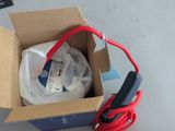 a box that has some wires in it and a cell phone in it