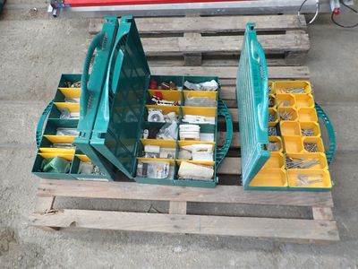 a green tool box sitting on top of a wooden pallet