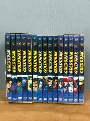 a set of six vhss of various anime characters sitting on a table