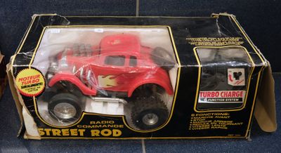a red toy truck that is in a box