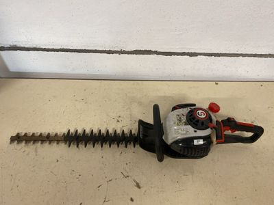 the hedger is sitting on the floor next to the wall