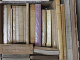 a box full of old books sitting on a table