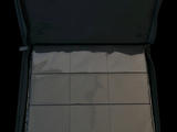 a black suitcase with a yellow handle that is open