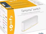a box with a white and yellow device inside of it