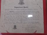 a document on display in a frame on the wall