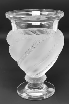 black and white photograph of a glass vase with a heart on it