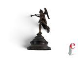 statue of a woman holding a sword and shield on top of a pedestal
