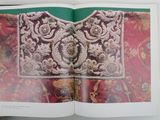 an open book with a picture of a woman on it