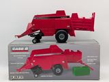 a red toy truck with a green box on it