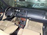 a car dashboard with a steering wheel and a dash board