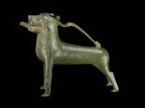 bronze statue of a dog with a leash attached to it ' s neck
