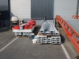 many different types of steel beams in a warehouse