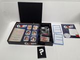 a box with a card game inside of it on a table