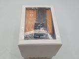 packaging of a watch in a white box on a white surface