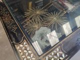 a table with a glass top that has a picture on it