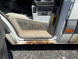 an image of a dirty car door with the door open