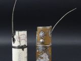 pair of silver and ivory vases with handles and handles