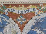 a map of the world on the wall of a building