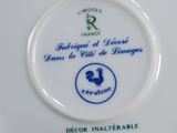 a white plate with a blue and white design on it