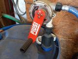 an image of a blue barrel with a red handle
