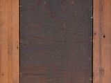 an old wooden frame with a black square in the middle of it