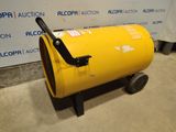 a large yellow barrel sitting on top of a cement floor