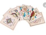 a group of cards with different designs on them on a white surface