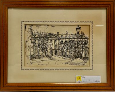 un dessin à l'encre représentant un bâtiment, encadré et posé sur une table