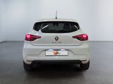 the rear end of a white car in a white room