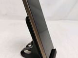 a cell phone that is sitting on a stand