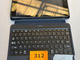 a laptop and a tablet on a table with a price tag on it