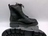 a close up of a pair of black boots on a white background