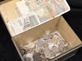 a box full of coins sitting on a black surface