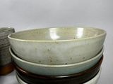 three bowls sitting on top of each other on a table