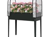 an image of a planter with flowers in it on a table