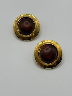 a pair of gold and wood button earrings