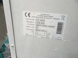 a label on the side of a machine that is sitting on the ground