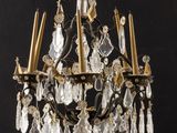 an image of a crystal chandelier hanging from a ceiling